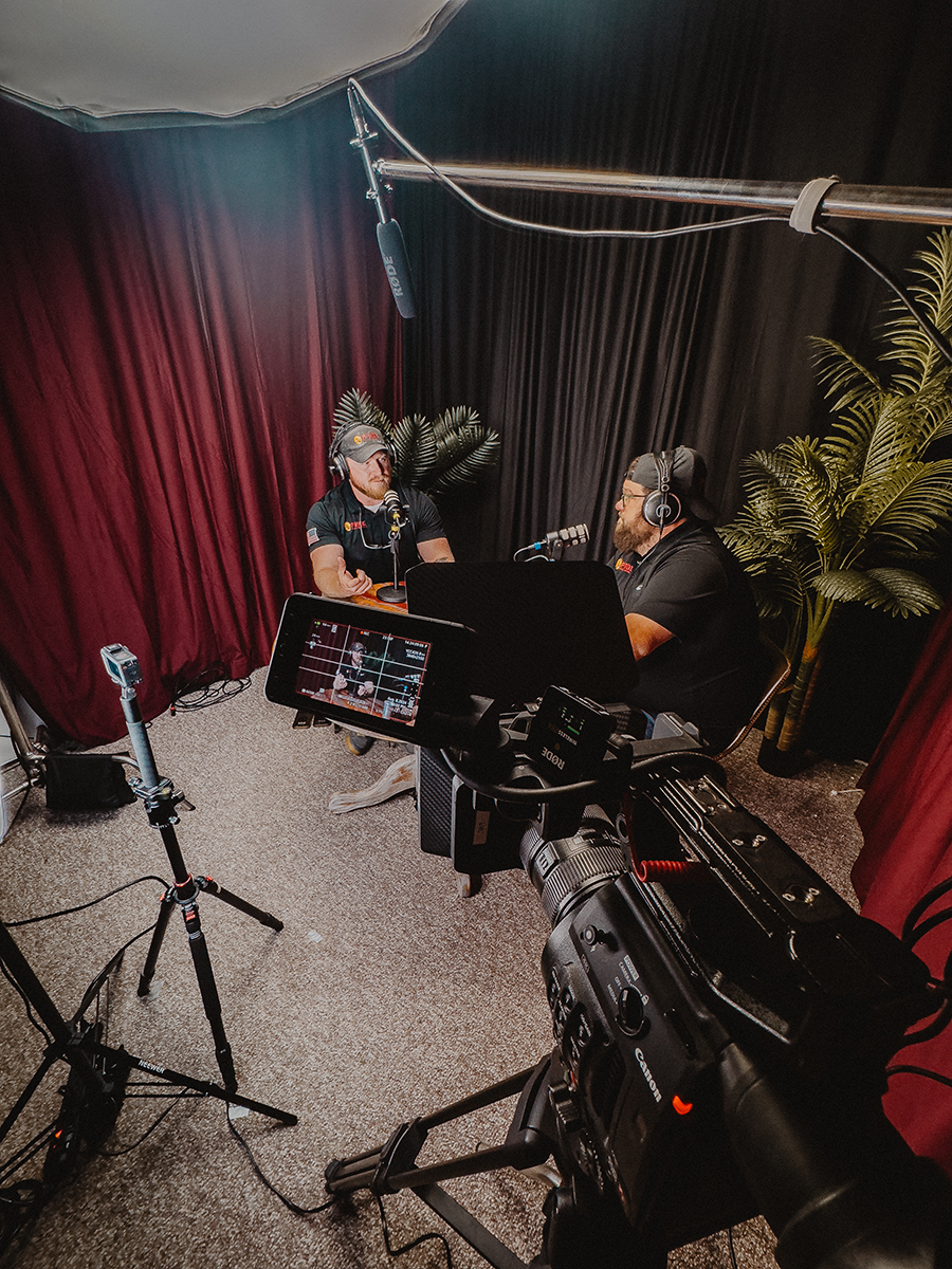 Behind the scenes of an Into the Lion’s Den recording with cameras, microphones and people in conversation
